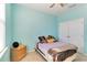 Light blue bedroom with a double bed and closet at 14822 Trinity Fall Way, Bradenton, FL 34212