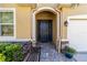 Elegant entryway with dark door and paved walkway at 14822 Trinity Fall Way, Bradenton, FL 34212