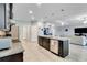 Modern kitchen with granite counters, stainless steel appliances, and dark cabinetry at 14822 Trinity Fall Way, Bradenton, FL 34212