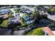 Aerial view showcasing a house near a lake in a residential area at 1608 Honey Ct, Venice, FL 34293