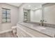 Double vanity bathroom with granite countertop and a mirror at 1608 Honey Ct, Venice, FL 34293