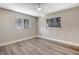 Bright bedroom with wood-look floors and ceiling fan at 1608 Honey Ct, Venice, FL 34293