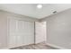 Bedroom with large closet and wood flooring at 1608 Honey Ct, Venice, FL 34293