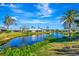 Peaceful canal view with lush greenery and houses at 1608 Honey Ct, Venice, FL 34293