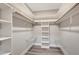 Spacious closet with built-in shelves and hanging rods at 1608 Honey Ct, Venice, FL 34293