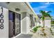 Dark brown double front doors with a modern design and sidelights at 1608 Honey Ct, Venice, FL 34293