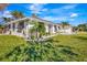 Modern white house with dark gray accents at 1608 Honey Ct, Venice, FL 34293