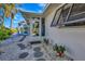 White house exterior with a walkway and landscaping at 1608 Honey Ct, Venice, FL 34293