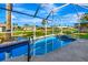 Enjoy this screened pool with canal views at 1608 Honey Ct, Venice, FL 34293