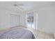 Bedroom with sliding doors that open to the pool at 1928 Greenlawn Dr, Englewood, FL 34223