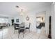 Bright dining area with glass table and chairs near the kitchen at 1928 Greenlawn Dr, Englewood, FL 34223