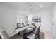 Bright dining room with dark wood table and seating for six at 1928 Greenlawn Dr, Englewood, FL 34223