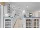 White kitchen with light blue countertops and ample cabinet storage at 1928 Greenlawn Dr, Englewood, FL 34223