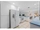 White kitchen with stainless steel appliances and ample counter space at 1928 Greenlawn Dr, Englewood, FL 34223