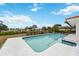 Inviting swimming pool in the backyard with a spacious deck at 1928 Greenlawn Dr, Englewood, FL 34223