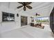 Screened porch with a view of the backyard and pool at 1928 Greenlawn Dr, Englewood, FL 34223