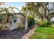 Brick house exterior with a brick walkway and tropical landscaping at 1947 W Leewynn Dr, Sarasota, FL 34240