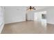 Spacious living room with tile floors and ceiling fan at 1947 W Leewynn Dr, Sarasota, FL 34240