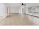 Open living area with tile floors and access to other rooms at 1947 W Leewynn Dr, Sarasota, FL 34240