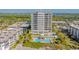 Aerial view of beachfront condo building and pool at 2050 Benjamin Franklin Dr # A601, Sarasota, FL 34236