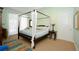 Serene bedroom with canopy bed and plenty of natural light at 2050 Benjamin Franklin Dr # A601, Sarasota, FL 34236