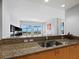 Modern kitchen with granite countertops and double sink at 2050 Benjamin Franklin Dr # A601, Sarasota, FL 34236