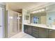 Spa-like bathroom with double vanity and walk-in shower at 223 Heritage Isles Way, Bradenton, FL 34212