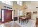 Elegant dining room with a large table, chandelier, and hardwood floors at 223 Heritage Isles Way, Bradenton, FL 34212