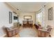 Cozy home bar area with leather armchairs and a rustic wood bar at 223 Heritage Isles Way, Bradenton, FL 34212