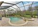 Relaxing screened pool and spa with water features at 223 Heritage Isles Way, Bradenton, FL 34212