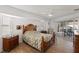 Bedroom with wooden furniture, tile floors and sliding doors to patio at 2421 Palomar St, North Port, FL 34287