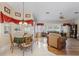 Bright dining area with a table for four and view into the living room at 2421 Palomar St, North Port, FL 34287