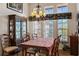 Dining area with wood table, chairs, and built-in hutch at 2421 Palomar St, North Port, FL 34287