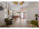 Living room with seating, view into dining room and tile floors at 2421 Palomar St, North Port, FL 34287