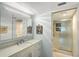 Modern bathroom with a walk-in shower and updated vanity at 2723 Orchid Oaks Dr # 104, Sarasota, FL 34239