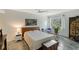 Bright bedroom with a queen-size bed and tiled floors at 2723 Orchid Oaks Dr # 104, Sarasota, FL 34239