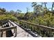 Wooden deck overlooking a tranquil waterway at 2723 Orchid Oaks Dr # 104, Sarasota, FL 34239