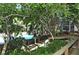 Wooden deck stairs leading to a refreshing pool area at 2723 Orchid Oaks Dr # 104, Sarasota, FL 34239