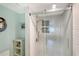 Walk-in shower with tiled walls and modern fixtures at 2723 Orchid Oaks Dr # 104, Sarasota, FL 34239