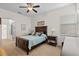 Bright bedroom featuring a comfortable bed and ensuite bathroom access at 2763 Phoenix Palm Ter, North Port, FL 34288