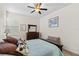 Well-lit bedroom with a cozy bed and plenty of storage at 2763 Phoenix Palm Ter, North Port, FL 34288