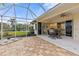 Spacious screened patio, view of backyard and pool at 2763 Phoenix Palm Ter, North Port, FL 34288