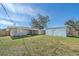 Large backyard with detached shed and grassy area at 2807 W 52Nd Ter, Bradenton, FL 34207