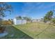 Large backyard with detached shed, offering ample outdoor space at 2807 W 52Nd Ter, Bradenton, FL 34207