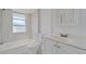 Clean bathroom with white vanity and bathtub at 2807 W 52Nd Ter, Bradenton, FL 34207