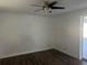 Bright bedroom with dark laminate flooring and ceiling fan at 2807 W 52Nd Ter, Bradenton, FL 34207