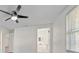 Bright bedroom with ceiling fan and access to bathroom at 2807 W 52Nd Ter, Bradenton, FL 34207