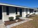 Gray house with black shutters and a landscaped front yard at 2807 W 52Nd Ter, Bradenton, FL 34207