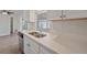 Renovated kitchen with white cabinets and quartz countertops at 2807 W 52Nd Ter, Bradenton, FL 34207