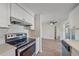 Modern kitchen with stainless steel appliances and white cabinets at 2807 W 52Nd Ter, Bradenton, FL 34207